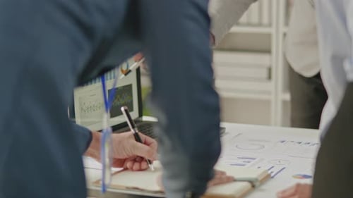 Close up of business hands are working and brainstorming on paperworks.