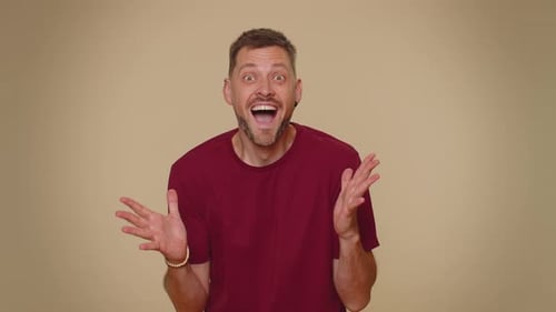 Man Reacts with Surprise and Joy