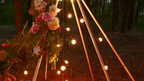 Wedding Teepee Decorated with Flowers and String Lights