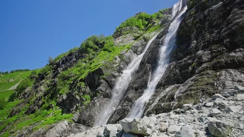 Streams of a Mountain Waterfall Falling Down