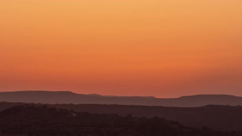 beautiful sunset time lapse looking out over the distant hills in the Texas Hill Country
