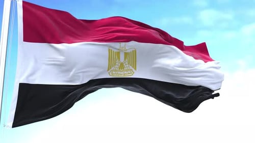 Realistic Waving Flag of Egypt Against a Blue Sky