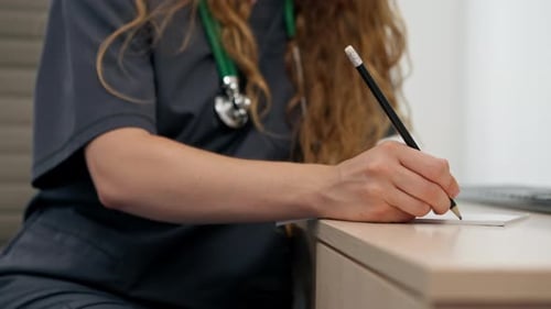 Closeup Hand In a Modern Clinic in a Small Therapist s Office a Young Girl Doctor with a Stethoscope