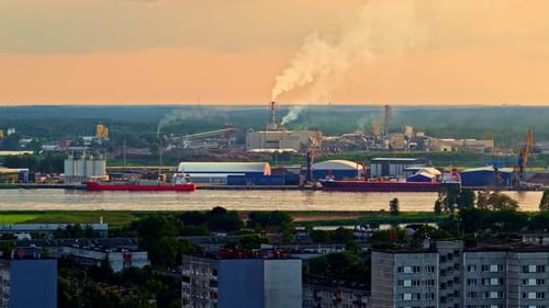 Industrial Port of Riga on the Daugava River at Sunset