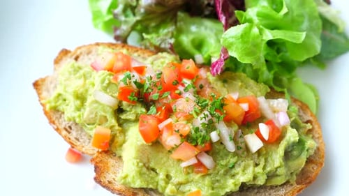 Close-up of Avocado Toast with Fresh Salad