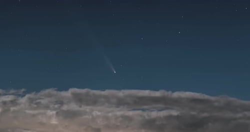 Night Sky Time-Lapse with Passing Clouds and Comet