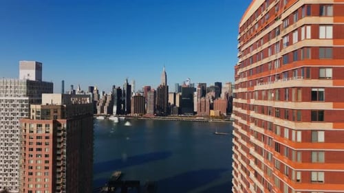 Breathtaking Midtown Manhattan Skyline From a High Rise Apartment on Queens Showcasing Lively Urban