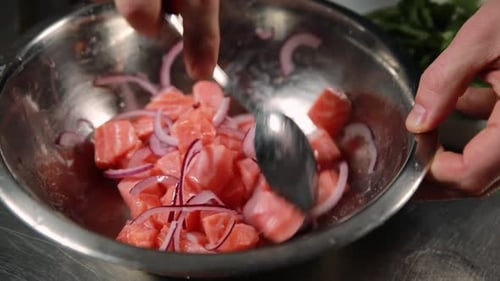 Preparing Diced Salmon and Onions in Bowl