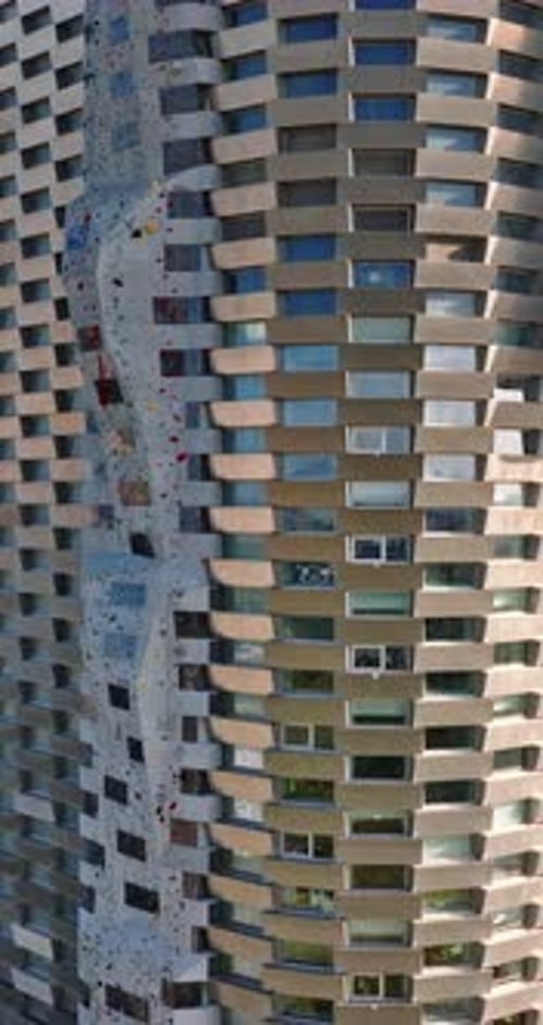 Aerial drone view of CopenHill artificial ski slope on the roof of an energy plant. Vertical