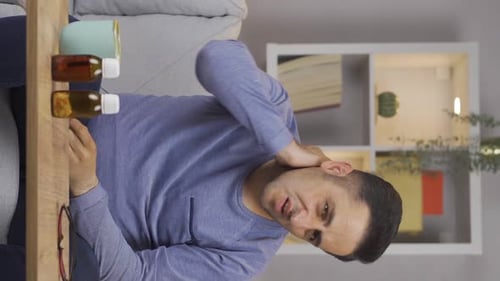Vertical video of Sick man suffering from neck pain.