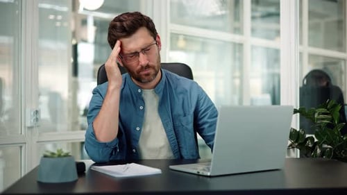 Overworked Stressed Tired Unhappy Businessman Having Headache in Office