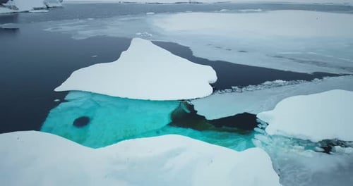Aerial View of Icebergs in Frozen Landscape