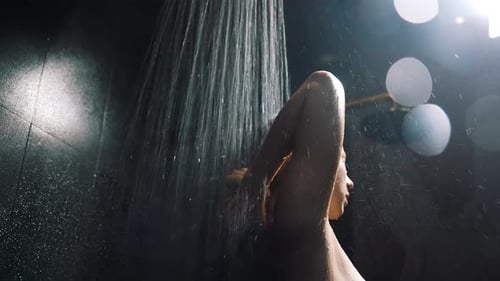 Young Woman Taking Hot Relaxing Shower in Luxury Private Villa