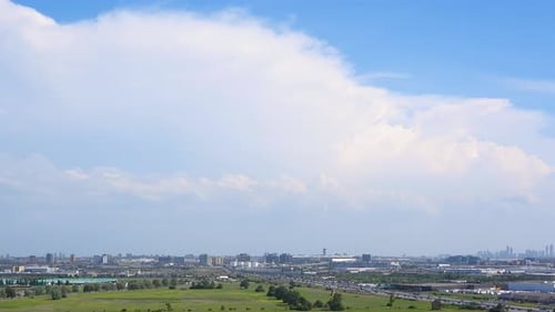 Toronto timelapse open green area, landing airplanes, highway traffic, city view and fast moving clo