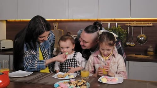 Family Enjoying Sweet Treats Together at Home