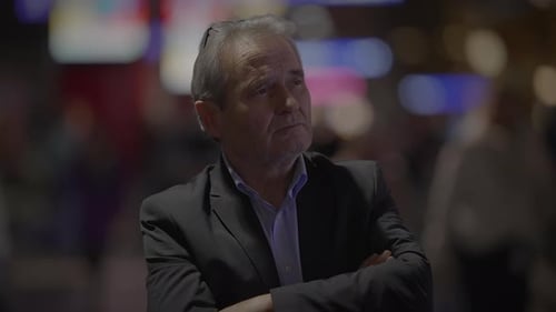 An Elderly Man Lost in Contemplation in the Busy City Reflecting on Life with a Serene Expression