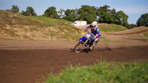 Motocross Racer Racing on Dirt Road in Extreme Slow Motion