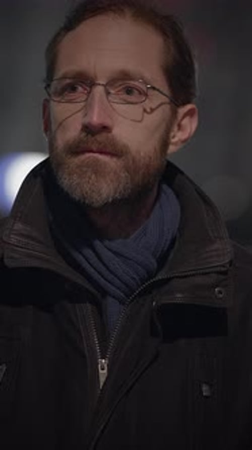 Man Outdoors at Night Wearing Glasses