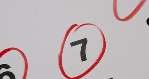 The Number Three is Highlighted in a Red Circle on a White Board