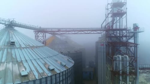 Metal modern agricultural farm container. Huge elevator construction storage.