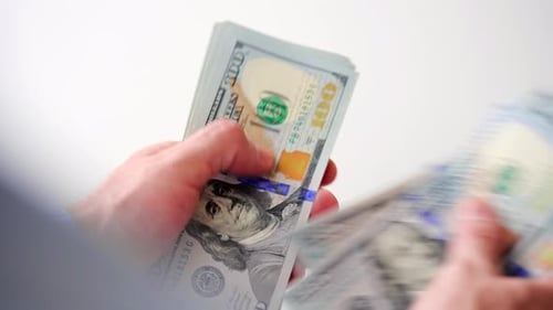 Male Hands Counting US Dollar Bills Closeup