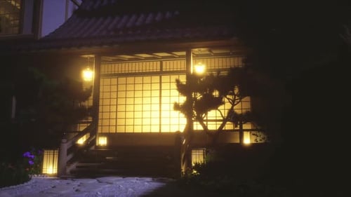 Traditional Japanese House with Glowing Shoji Screens at Night