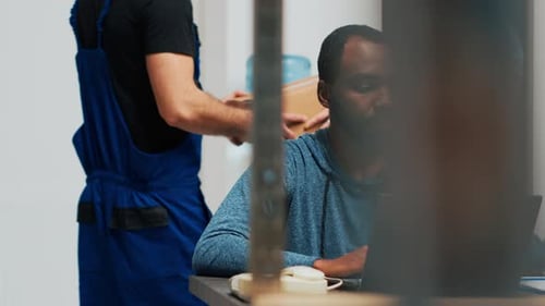 Diverse Office Workers Looking at Products in Boxes Before Shipping Order