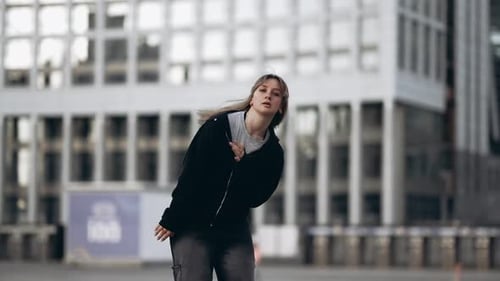 Young Woman Dancing Hip Hop on the Street