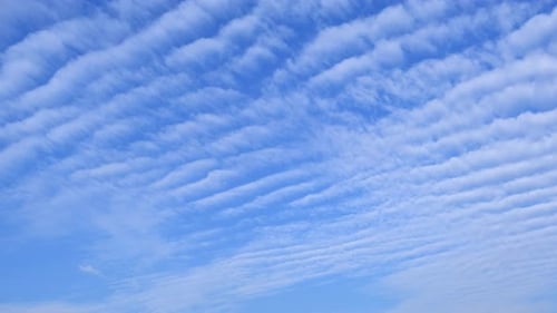 Blue sky with fluffy cloud time lapse on a sunny day 4k footage.