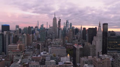 Sunset Bathing the New York City Skyline in Warm Hues Highlighting the Buildings and Streets Below
