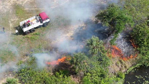 Scorching Flames Devour Florida Forest Vegetation During Drought Season As Firefighting Crews Arrive