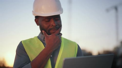 Professional Engineer or Architect Examining Project and New Building in City Medium Portrait of