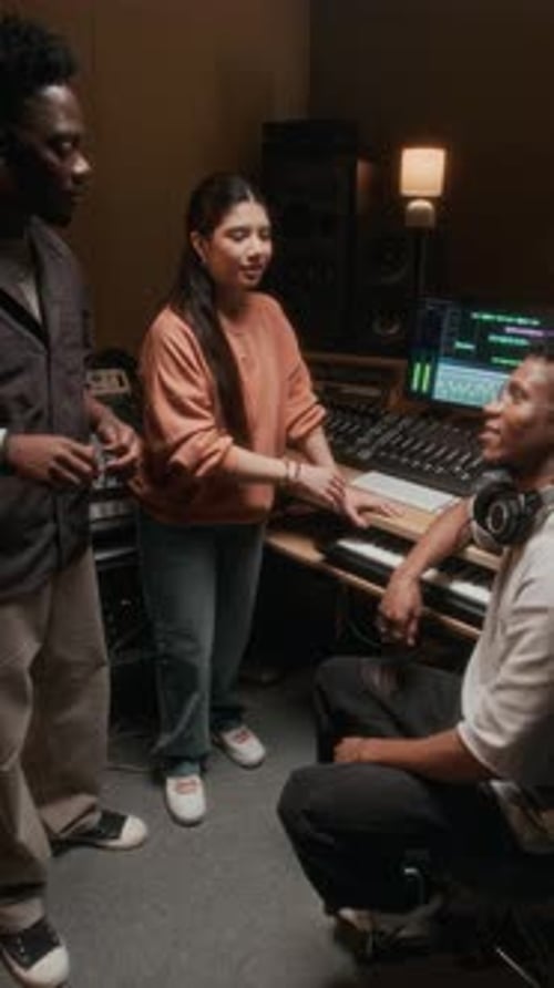 Music Band High Five in Recording Studio Vertical