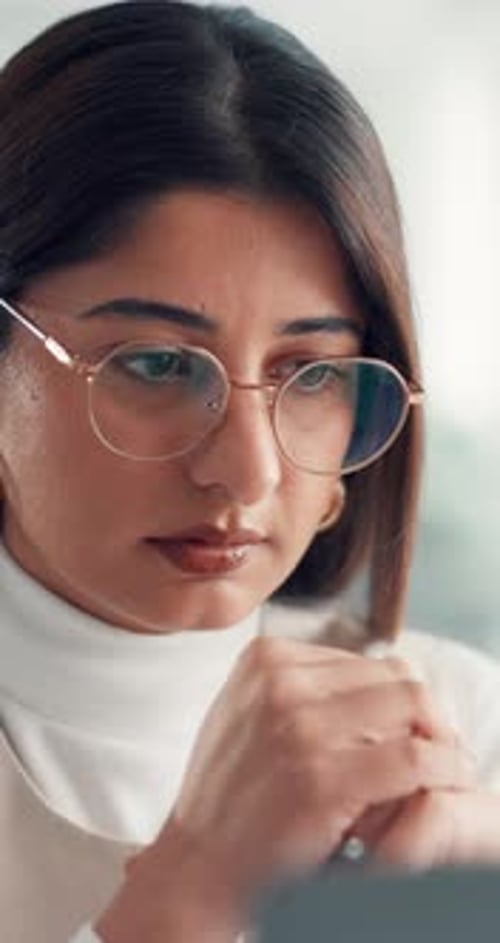 Reading, glasses and business woman in office for financial review, budget planning and proposal