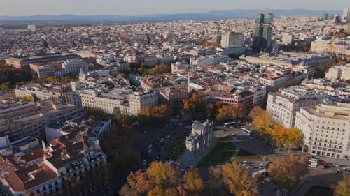 A Stunning Aerial View of a Vibrant and Colorful Cityscape Surrounded By Fall Foliage