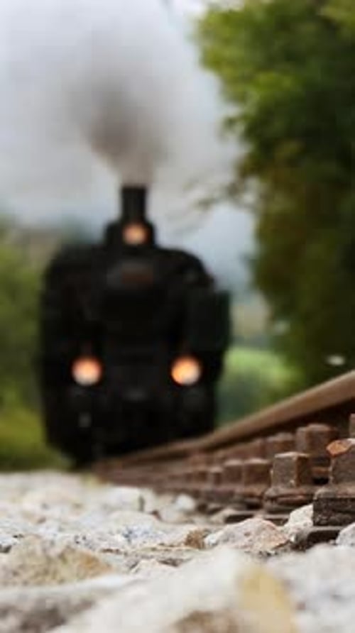 A Vintage Steam Train is Chugging Through a Beautiful Scenic Landscape Full of Natures Splendor