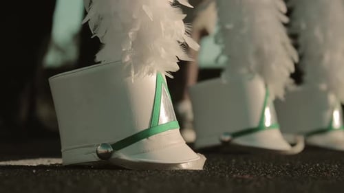 White Feathered Marching Band Hats Close Up