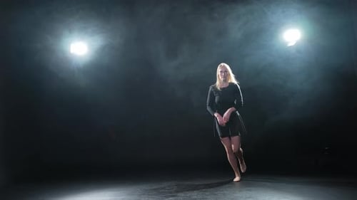 Contemporary Woman Dancer Posing on Black Background with Smoke Adult Female Artist Performer