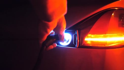 Charging Futuristic Electric Car at Night