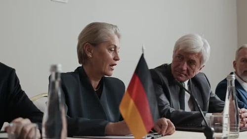 Officials Seated for Formal Discussion at Global Summit