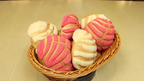 Basket of Colorful Mexican Concha Bread