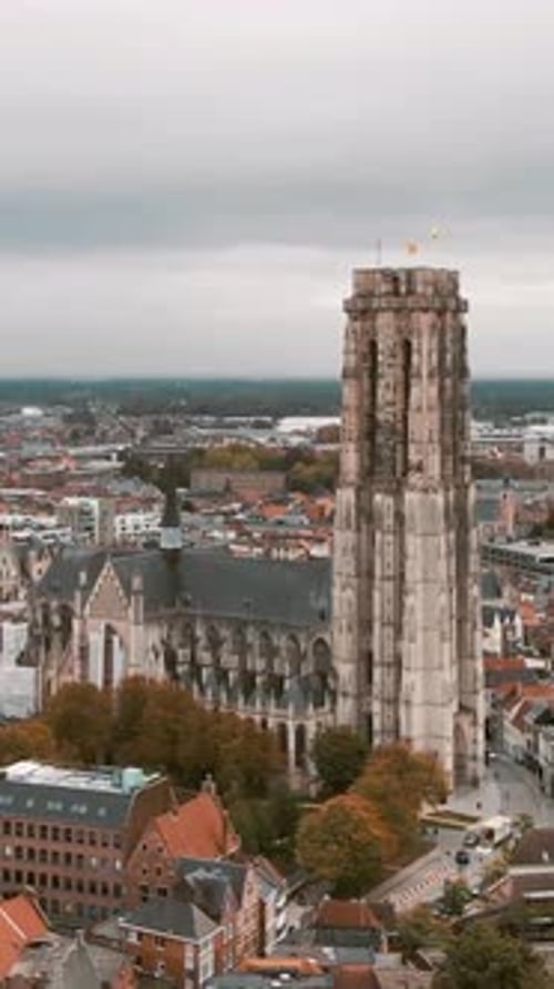 Dramatic aerial vertical shot of Saint Rumbold’s Cathedral in Mechelen, Belgium