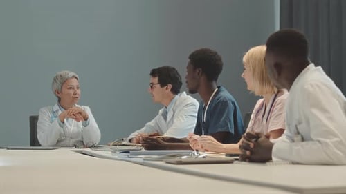 Medical Professionals Meeting at Conference Table