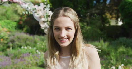 Smiling Woman Outdoors in a Garden