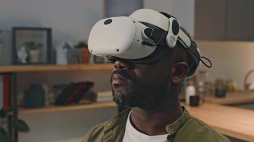 Man Wears VR Headset in Home