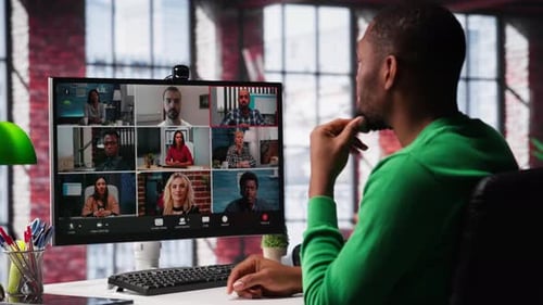 Man Participates in a Virtual Meeting