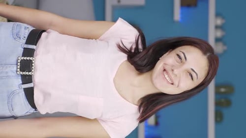 Smiling Woman Poses Indoors in Portrait Video