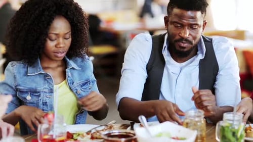 Friends enjoying lunch together in bright restaurant