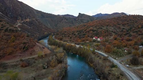 Aerial View of River in Mountain Valley