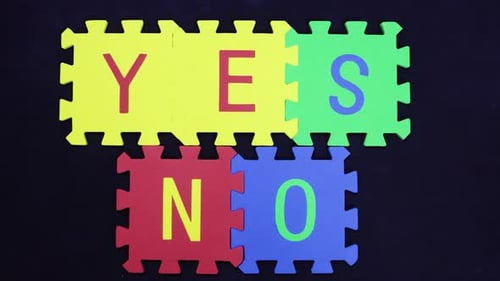 Colorful Puzzle Pieces Forming Yes No Choice Concept